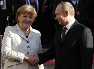 Путин встретился с Меркель со второй попытки